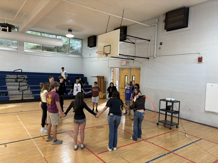 Students playing the hula hoop game