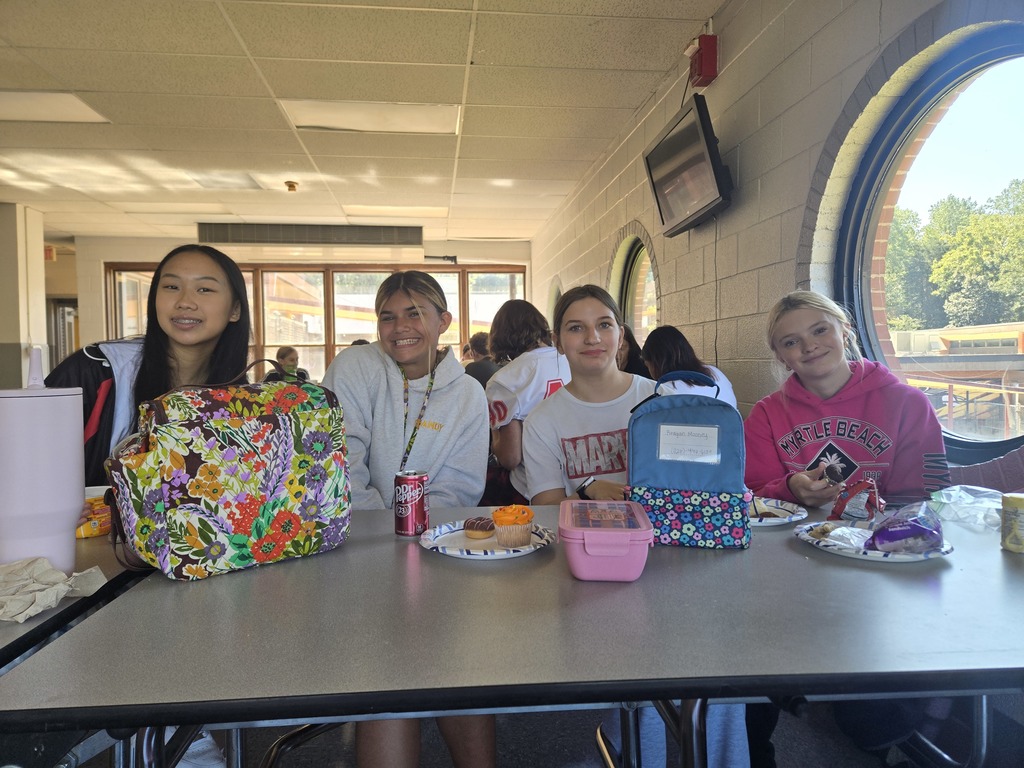 Freshmen enjoying each other's company at lunch