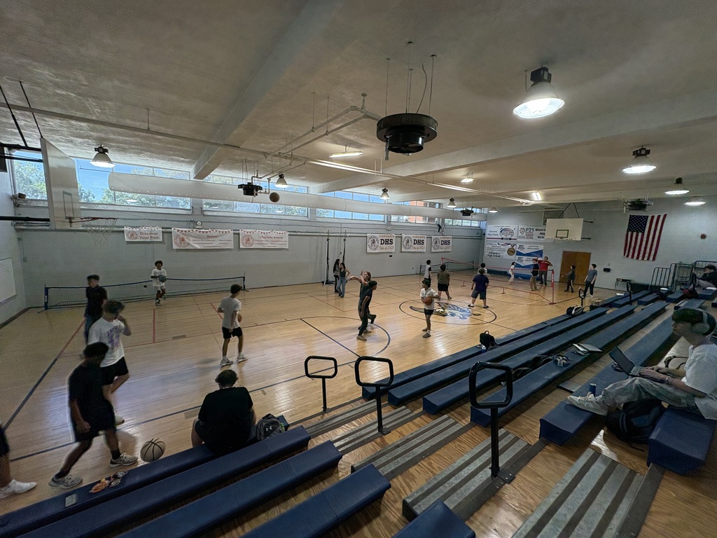 DHS students play basketball, badminton, and volleyball in the gym during lunch.
