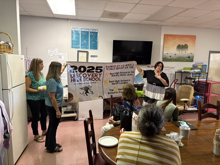 N-CCS staff present the banner to DHS staff
