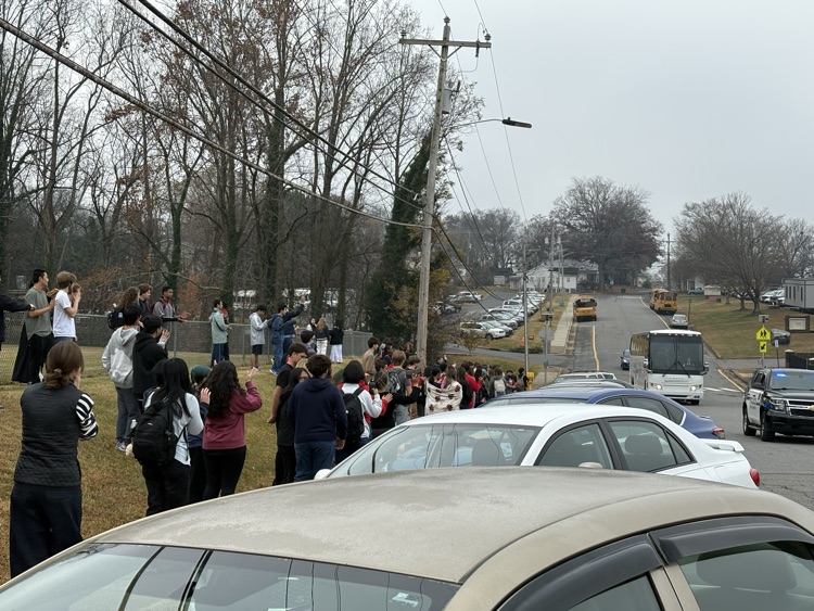 DHS students cheer on the soccer team as they travel to Greensboro for the state championship match 