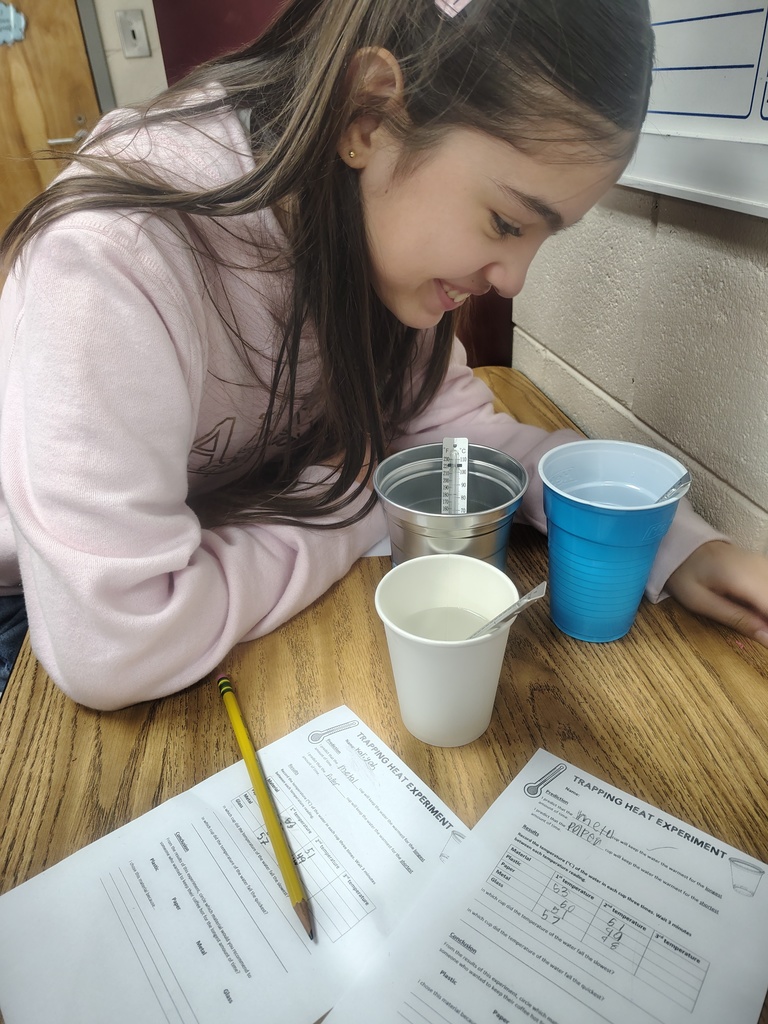 Mrs. White's 5th graders conducting experiments to learn more about thermal energy.