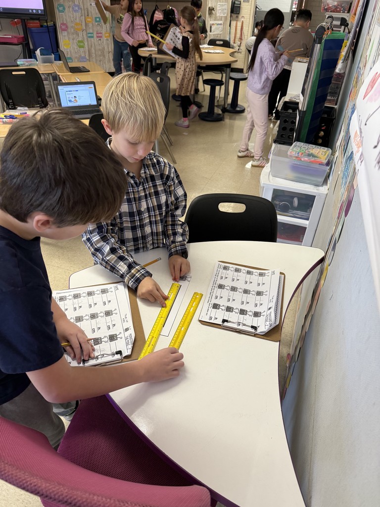 Mrs. Smyre's 2nd graders, working on their measurement unit.