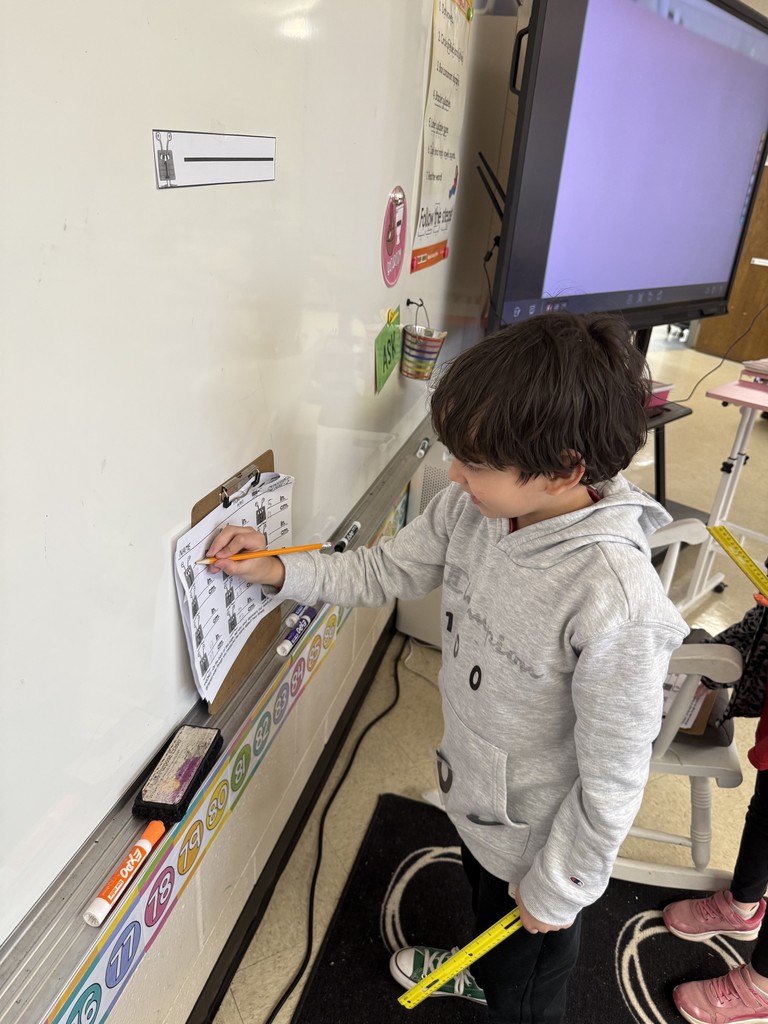 Mrs. Smyre's 2nd graders, working on their measurement unit.