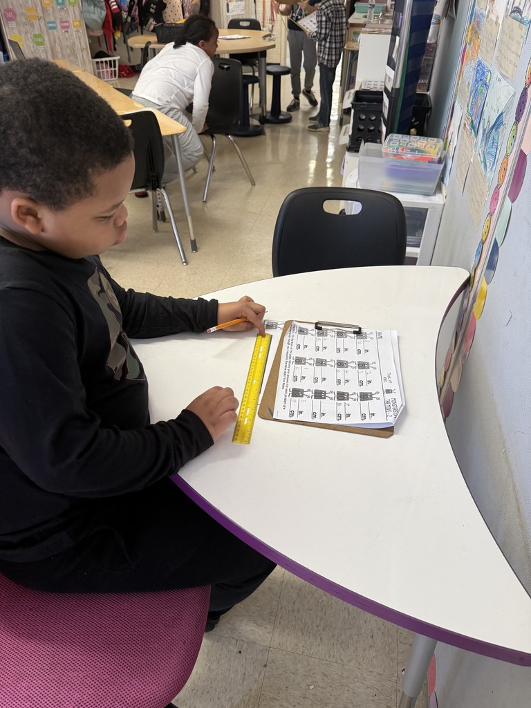 Mrs. Smyre's 2nd graders, working on their measurement unit.