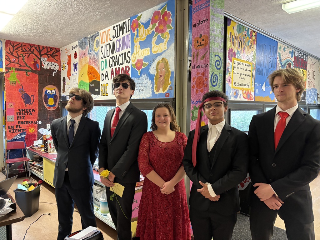 Anthony, Josh, Grace, Kent, and Jonathan dressed up to present roses to students today