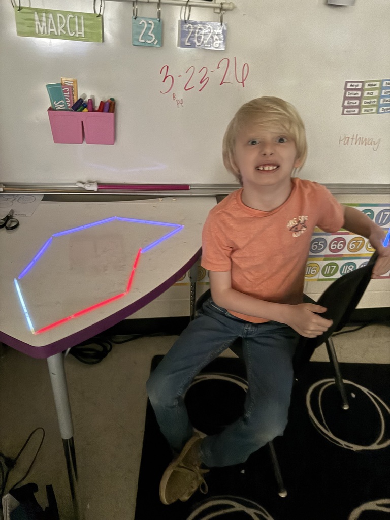 Ms. Smyre's class lighting up learning with 2-D shapes.
