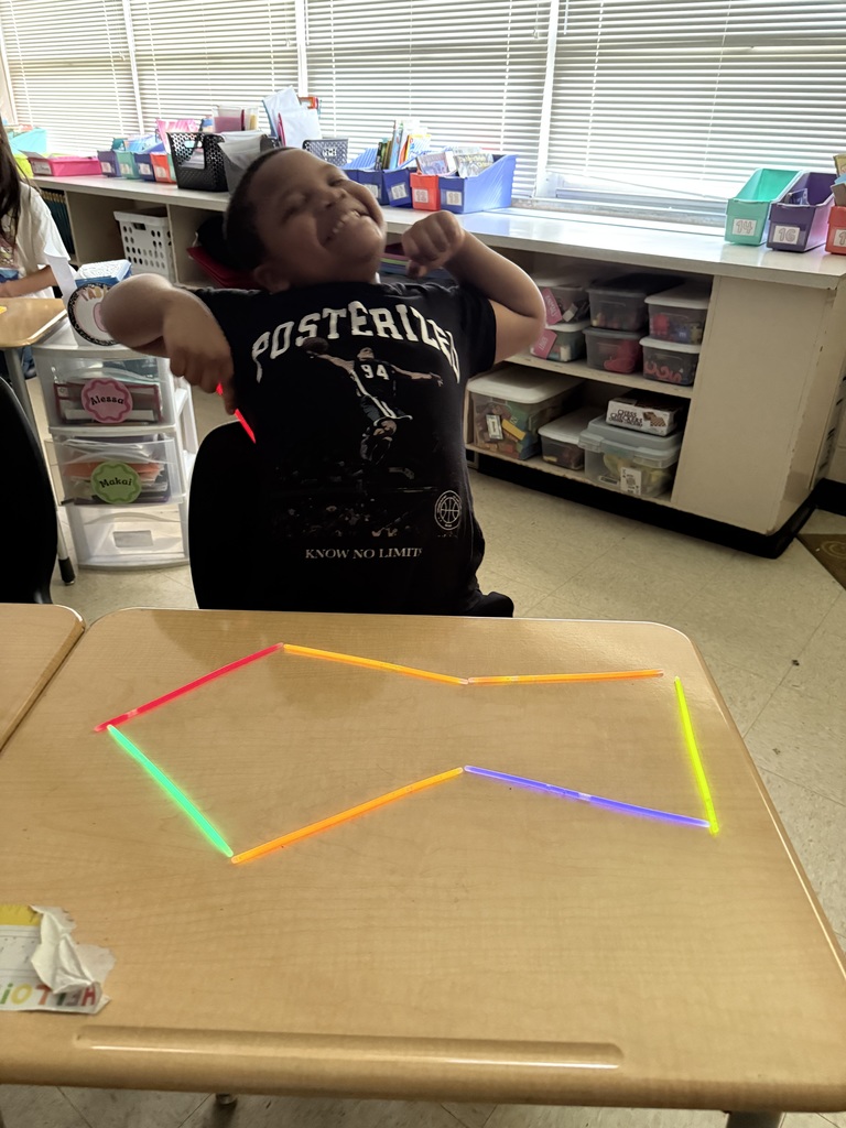 Ms. Smyre's class lighting up learning with 2-D shapes.