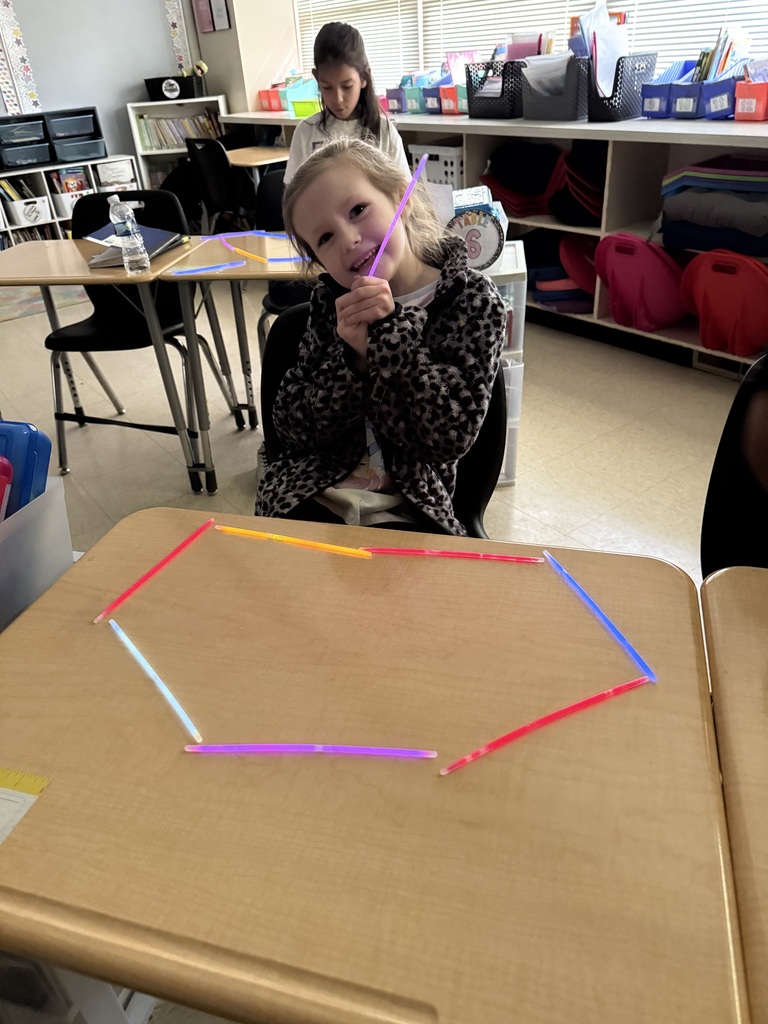 Ms. Smyre's class lighting up learning with 2-D shapes.