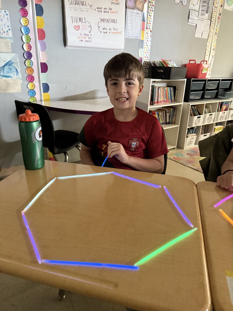 Ms. Smyre's class lighting up learning with 2-D shapes.
