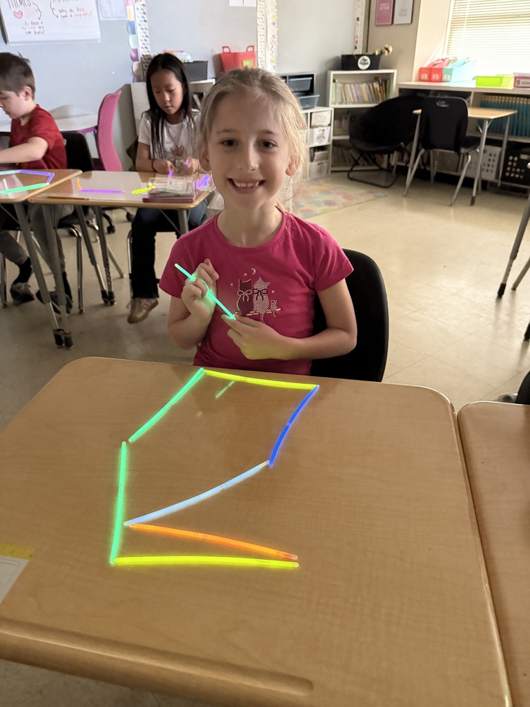 Ms. Smyre's class lighting up learning with 2-D shapes.