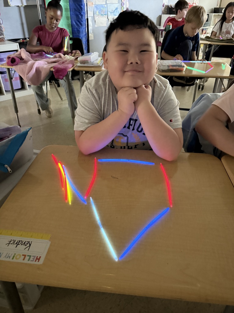Ms. Smyre's class lighting up learning with 2-D shapes.