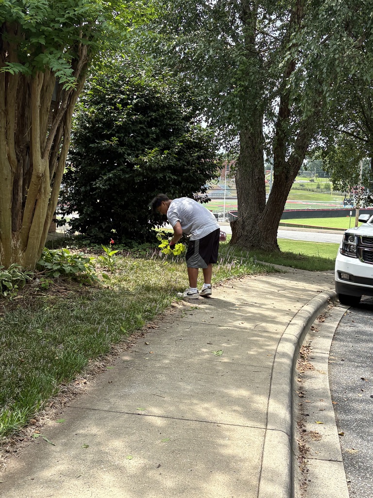 Marvin weeding a flower bed