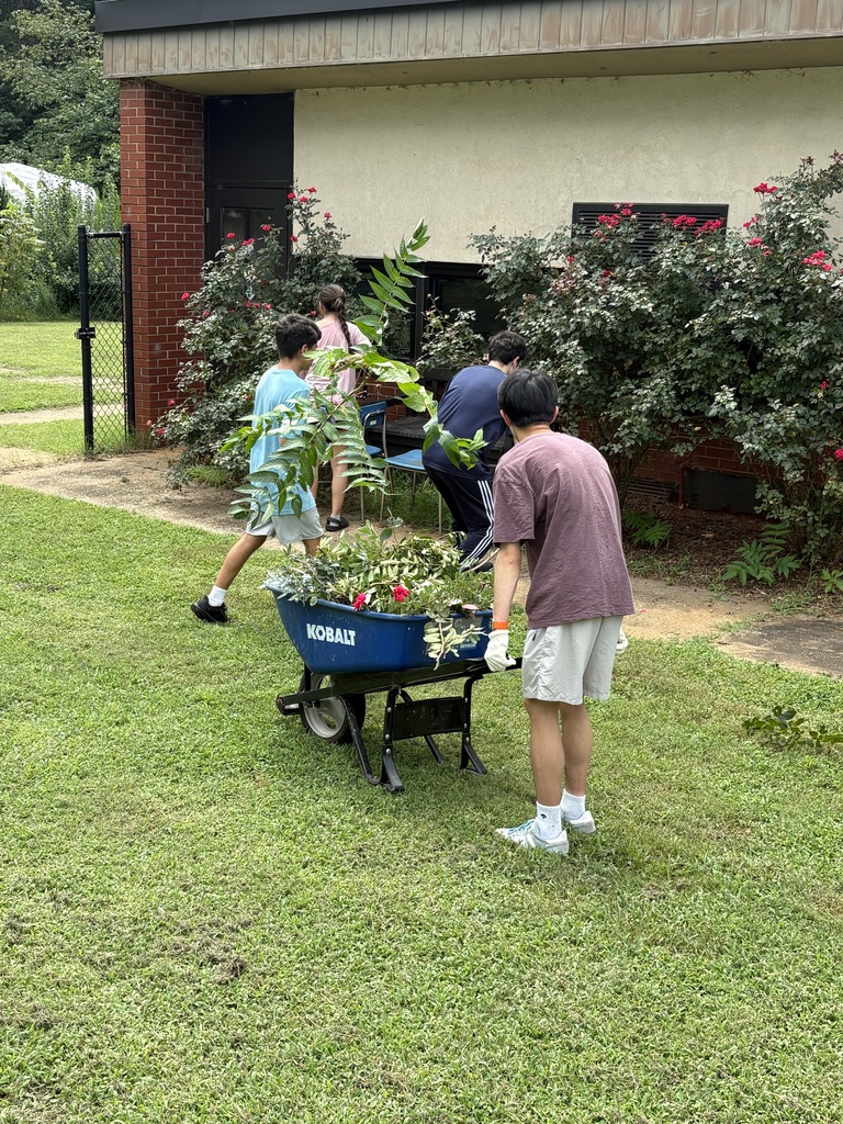 Kate, Memphis, Alp, and Albert trimming rose bushes