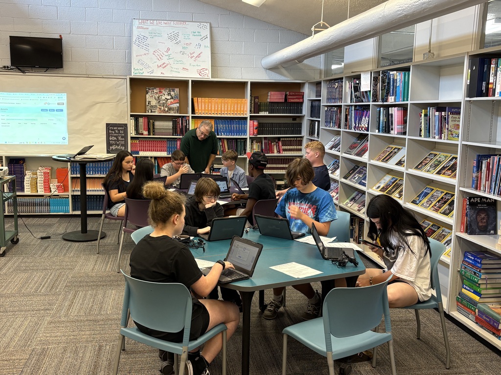 Students are assisted with logging into their chromebooks