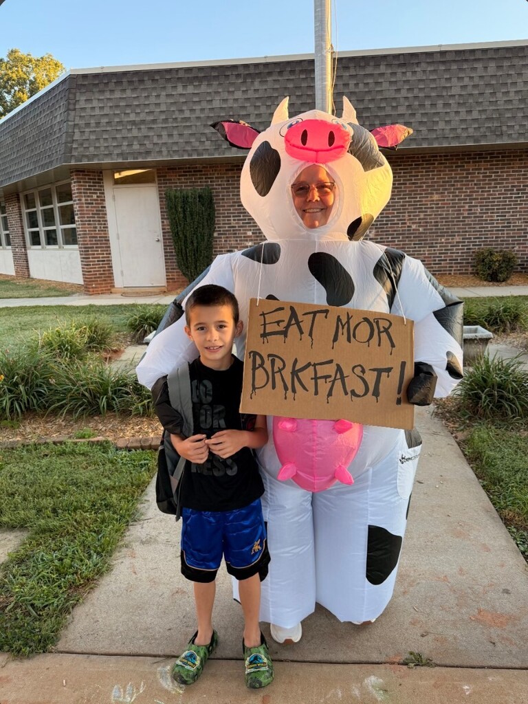 Nancy Price dressed up as a cow for World Milk Day - along with students