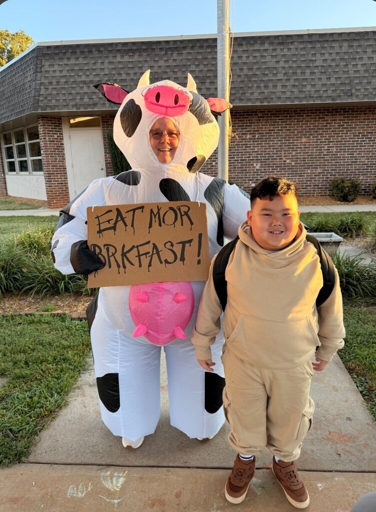 Nancy Price dressed up as a cow for World Milk Day - along with students