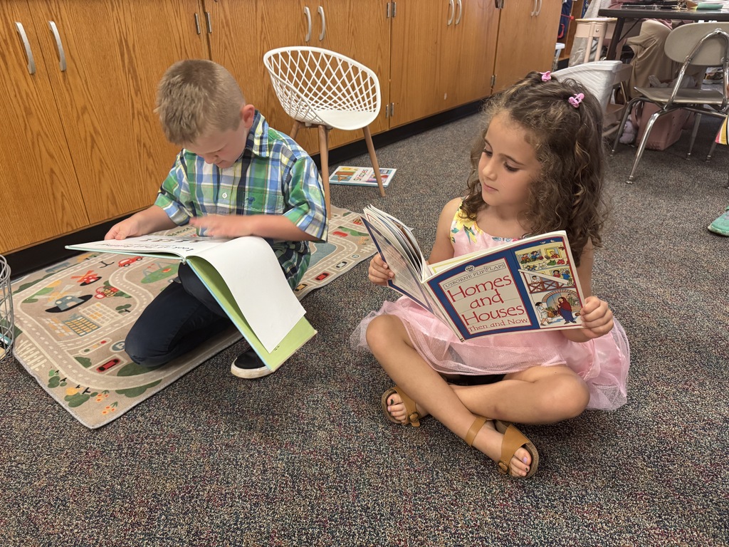 elementary students reading book