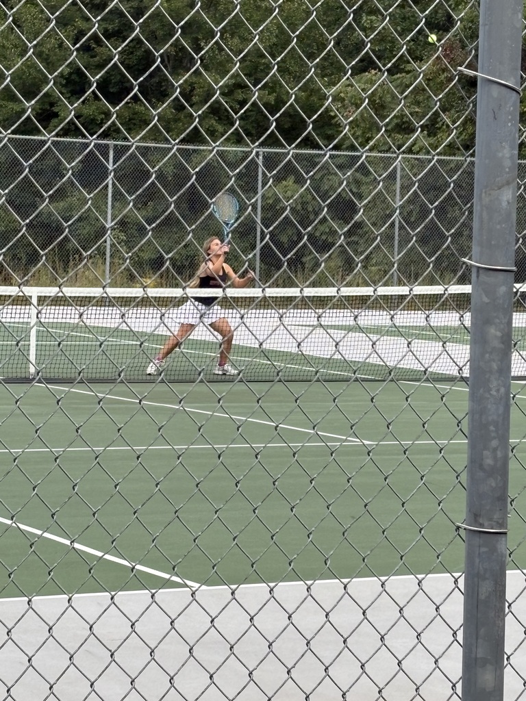 Calleigh gets ready to return a volley in the doubles match