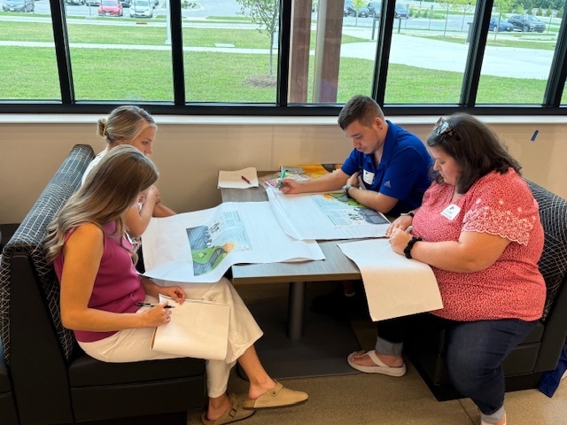teachers looking at a map