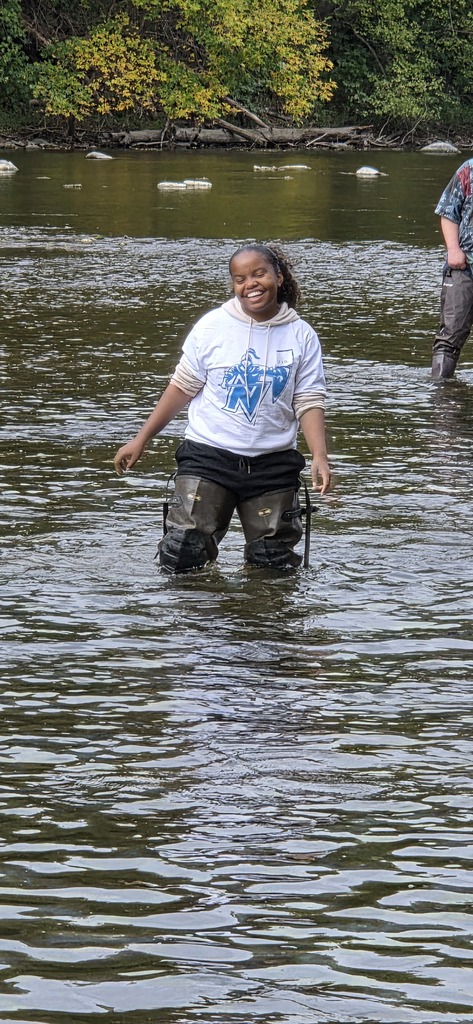 a girl in waiters in the river