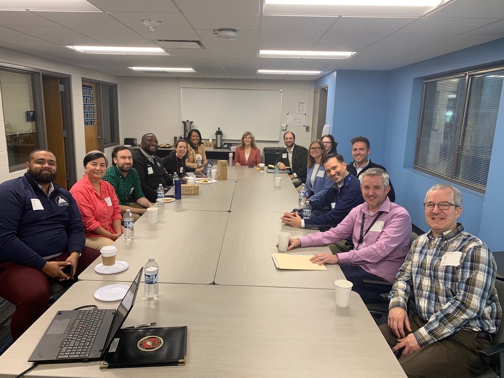 a picture of administrators smiling for a picture