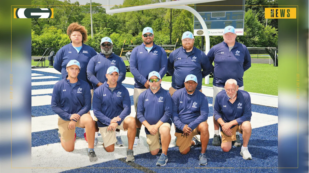 a picture of football coaches smiling for a picture