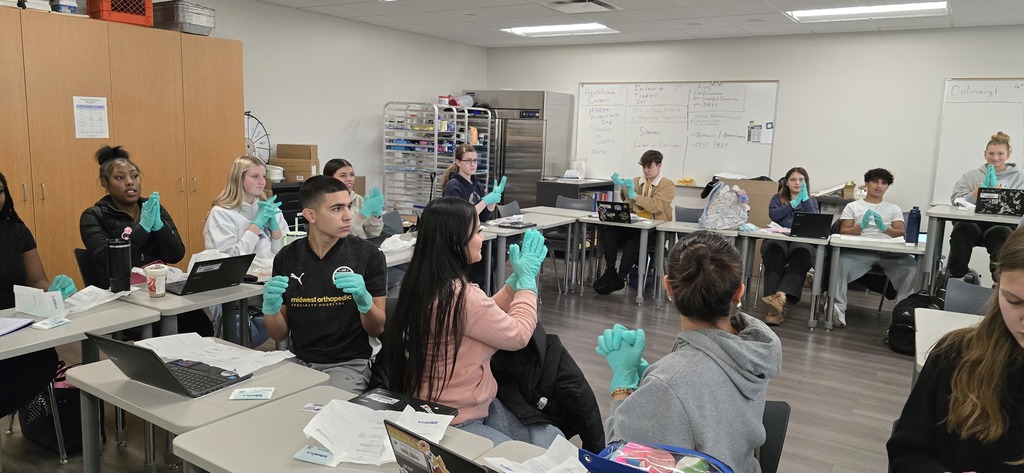 a picture of students wearing blue gloves