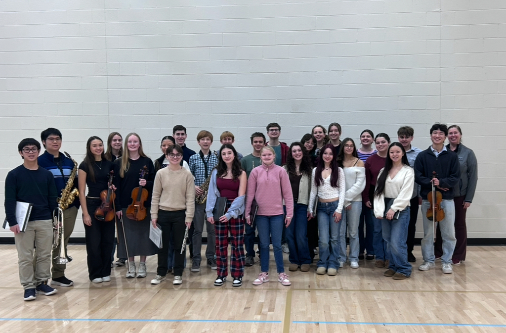 a picture of music students smiling for a picture