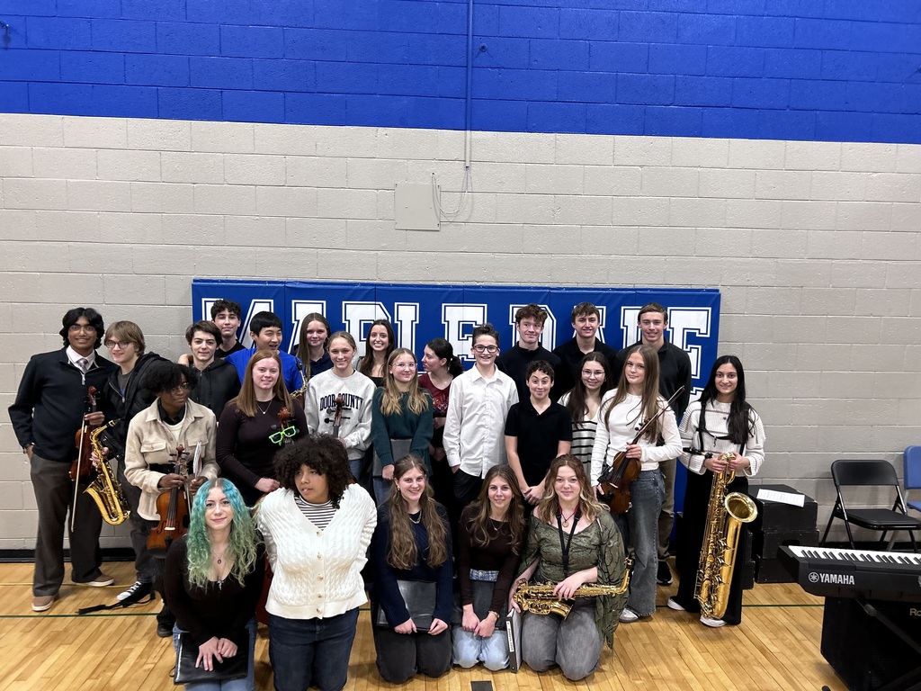 a picture of music students smiling for a picture