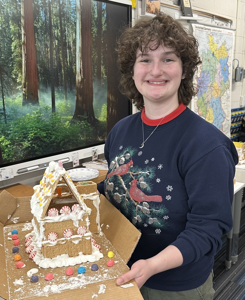  a picture of students making a gingerbread house