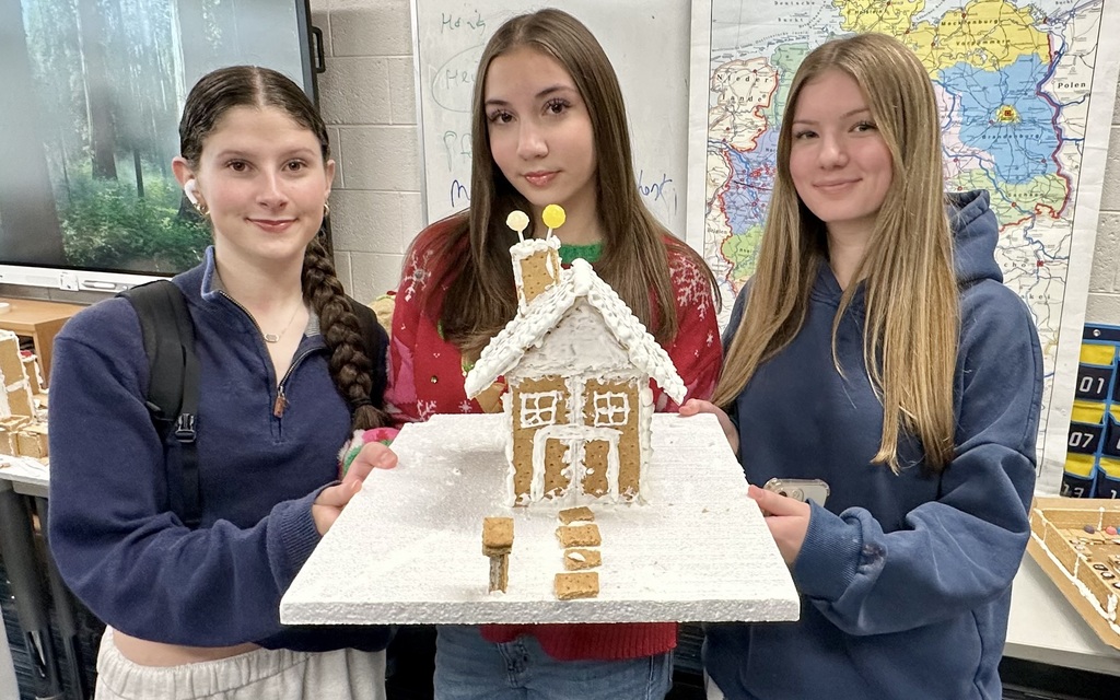 a picture of students making a gingerbread house