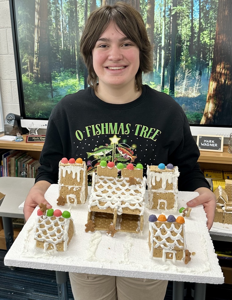  a picture of students making a gingerbread house
