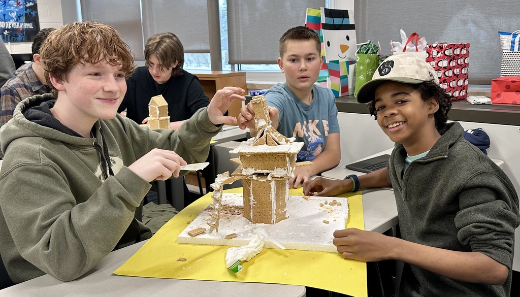  a picture of students making a gingerbread house