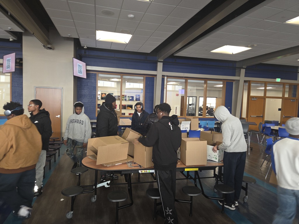 a  picture of students boxing up toys