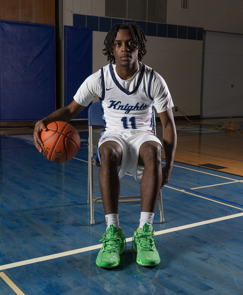 a picture of a boy dribbling a basketball
