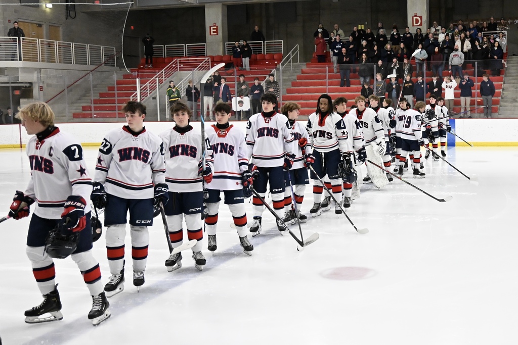 a picture of hockey players smiling for a picture