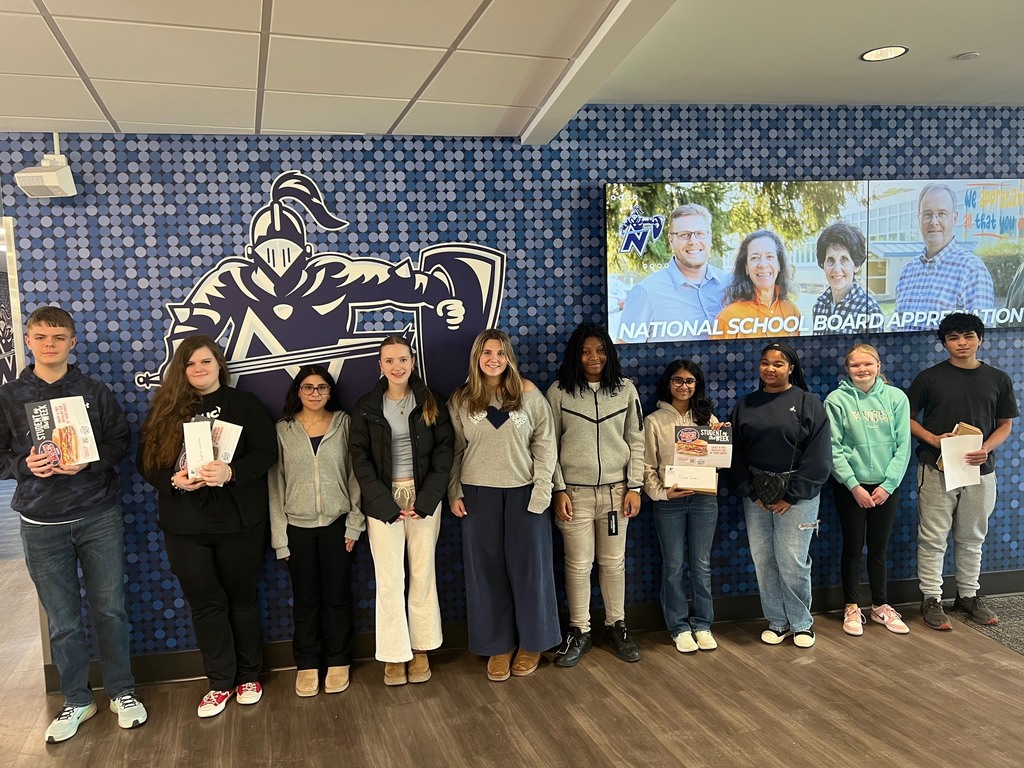 students of the month smiling for a picture