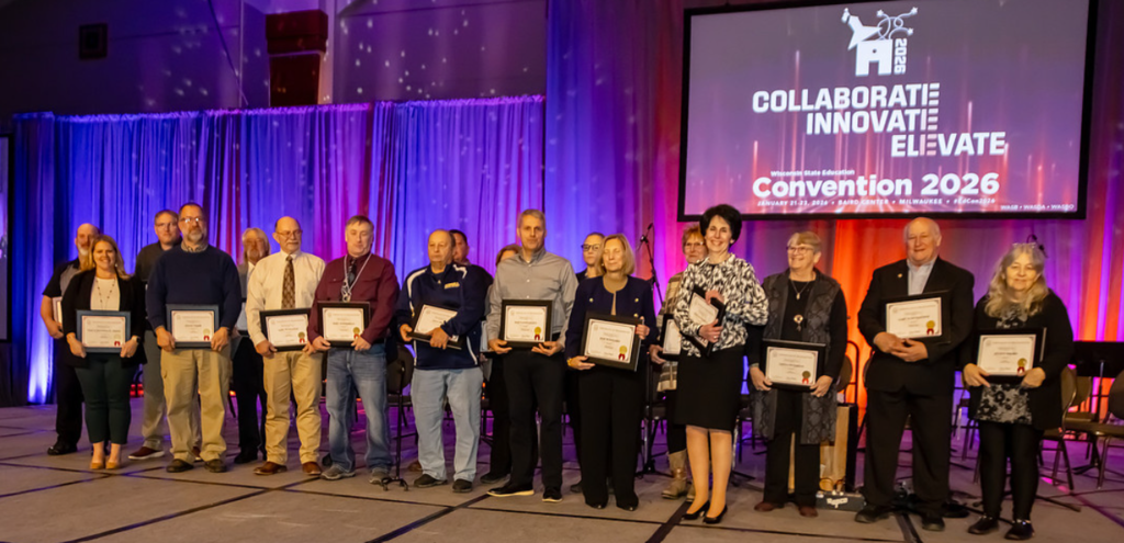 a picture of a women holding an award