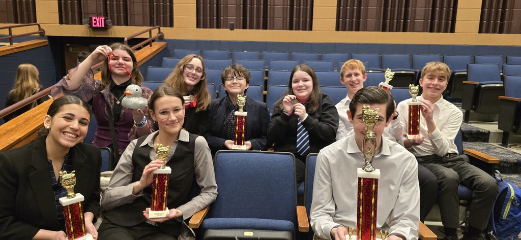 a picture of students posing with their awards