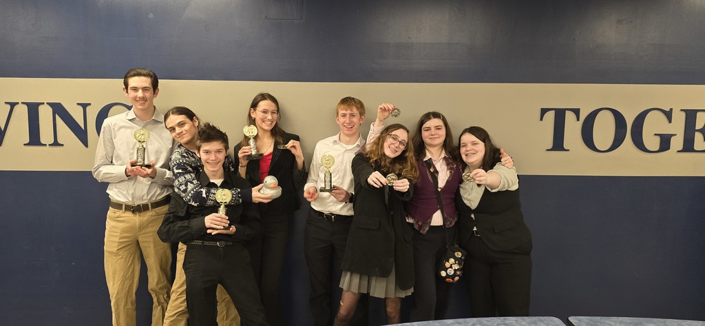 students showing awards