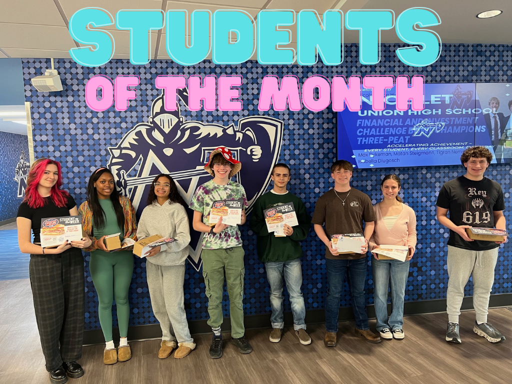 Eight students, some holding certificates, stand in a row in a room with blue tiles.