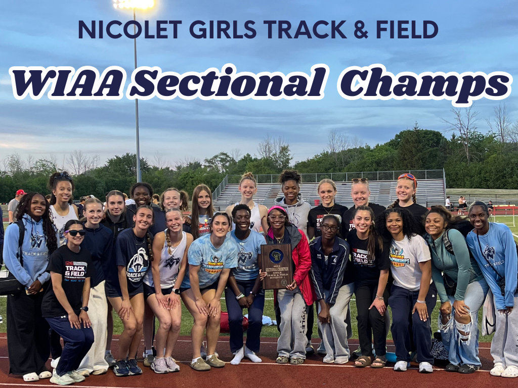 A group of women wearing team uniforms pose for a photo on a track field, holding a trophy.