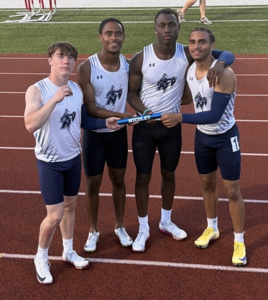 Four young men in matching white shirts and shorts pose on a track, holding a baton.