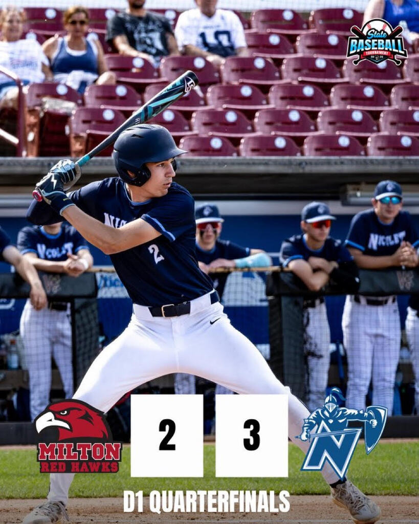 A baseball player in blue and white swings a bat at a game. The score is 2 to 3.