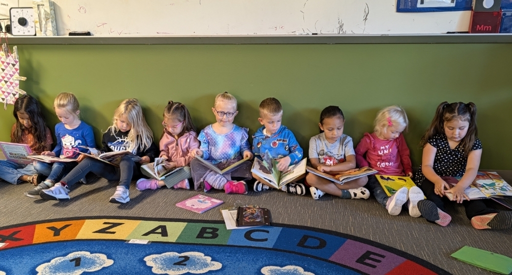 Preschoolers enjoy looking at books!