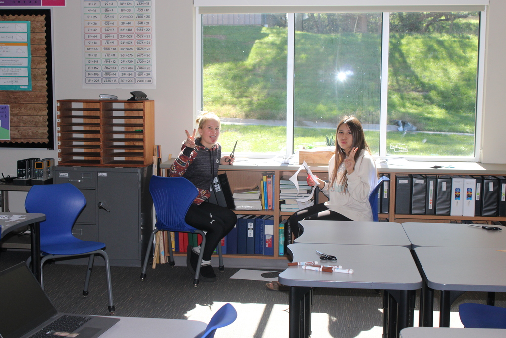 two sophomores drawing in a classroom 