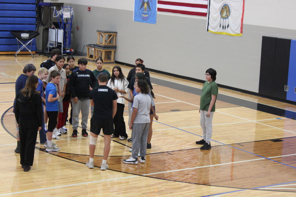 Arlan coaching his team 