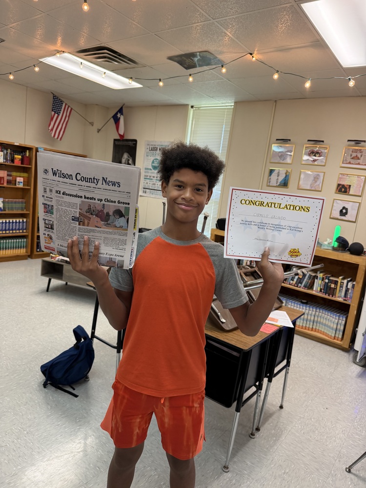 student holding paper