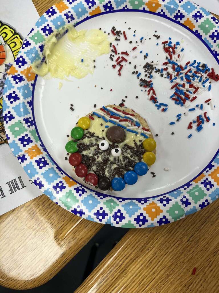 Cookie on plate with sprinkles